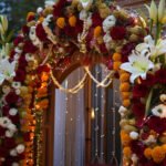 Entrance gate decoration using fresh flowers by by Hamd Flower Decoration.